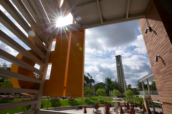 HUB building and sign with sunlight shining through
